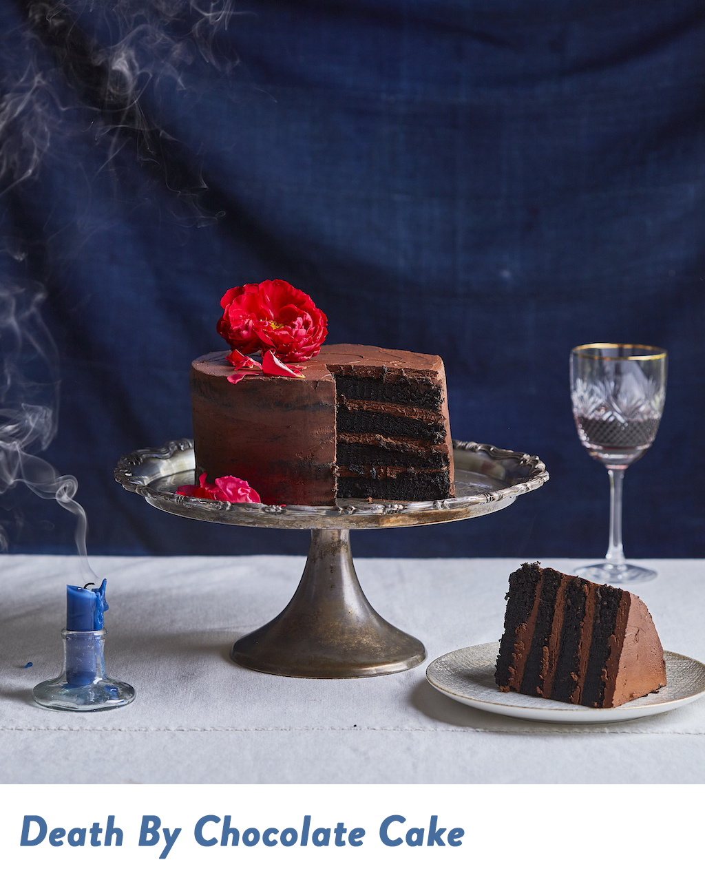 Death By Chocolate Cake next to a candle and slice