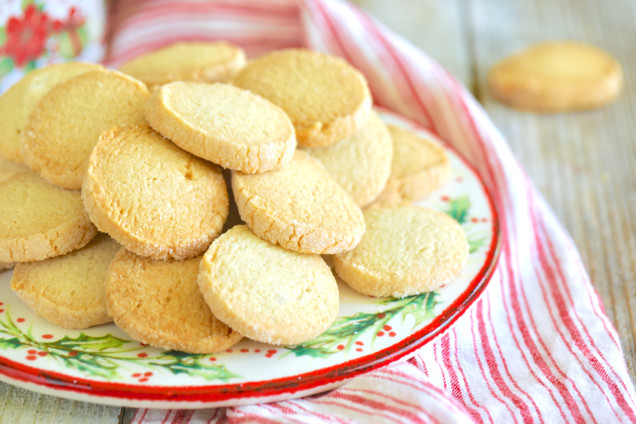 A pile of gluten free sugar cookies, perfectly baked and ready to eat.