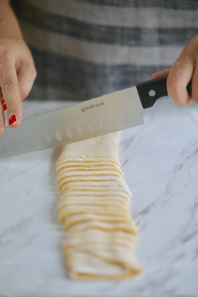 A knife slicing my 2 ingredient pasta.